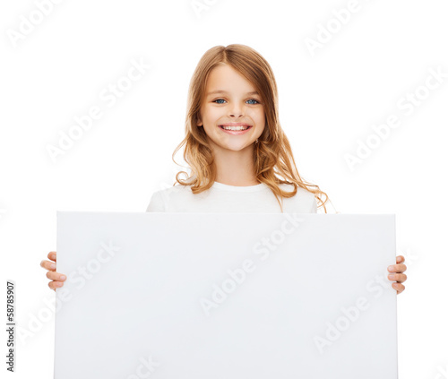 smiling little girl with blank white board