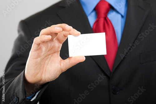 Businessman showing blank card