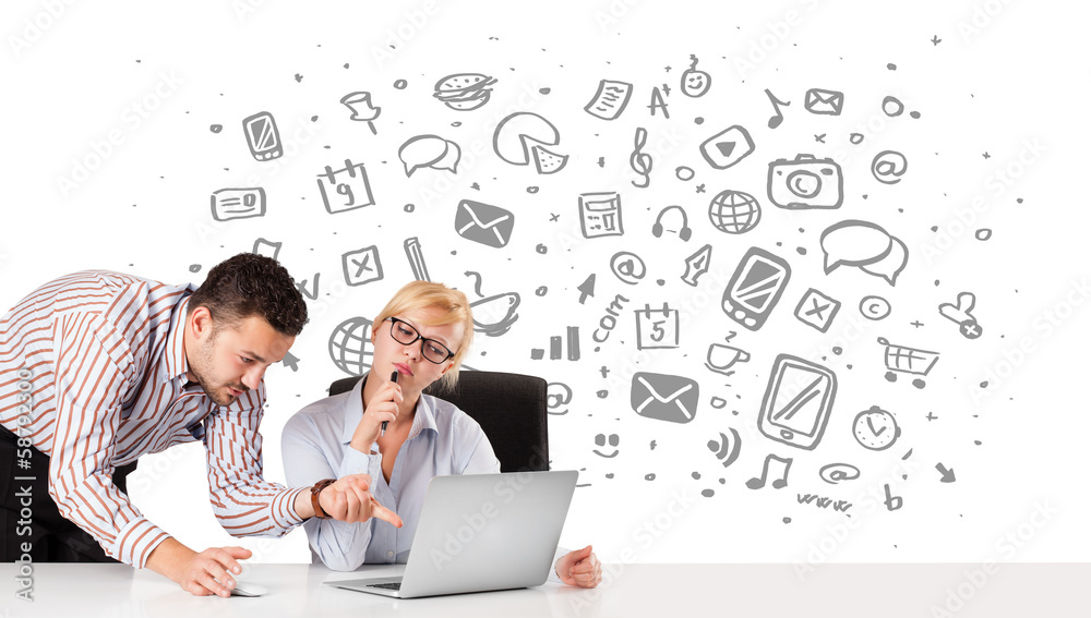 Obraz premium Businessman and businesswoman with all kind of hand-drawn icons