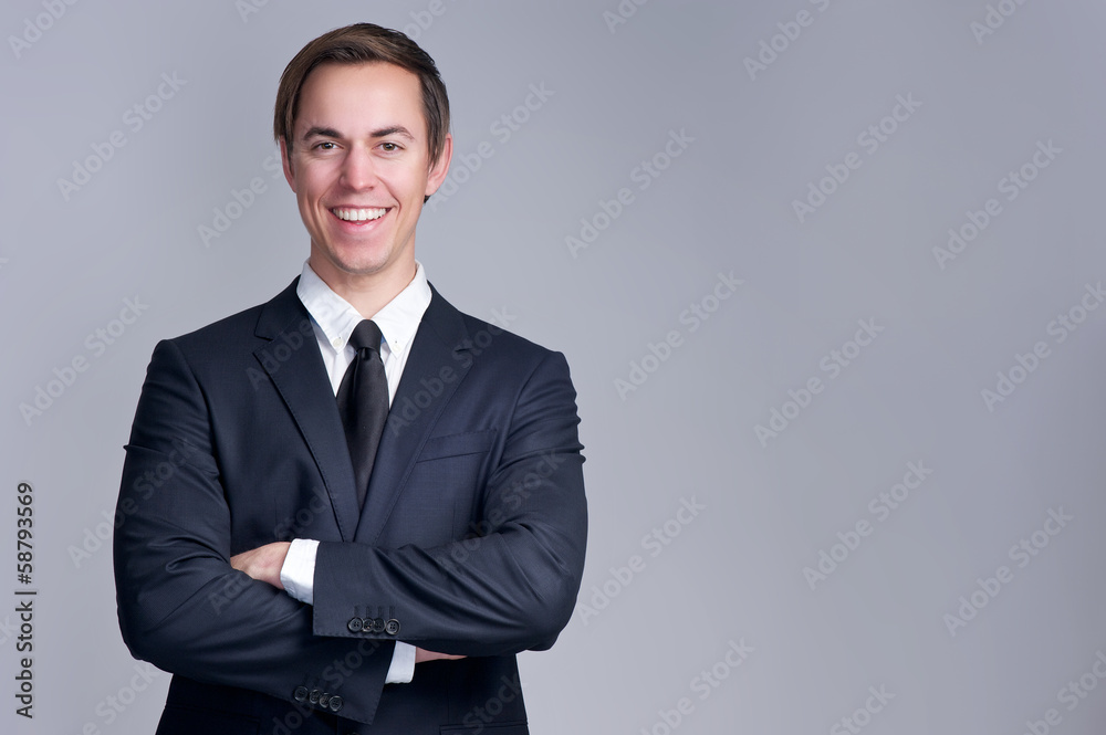 Portrait of a relaxed business man smiling with arms crossed Portrait of a relaxed business man smiling with arms crossed