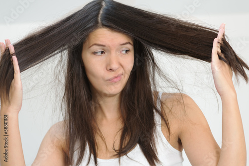 Woman unhappy with the condition her long hair