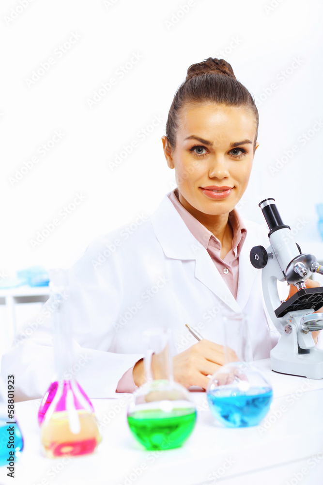 Young female scientist working in laboratory Young female scientist working in laboratory