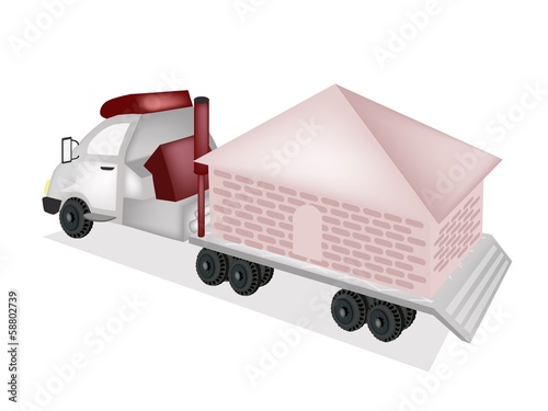 A Small House Being Towed by A Truck