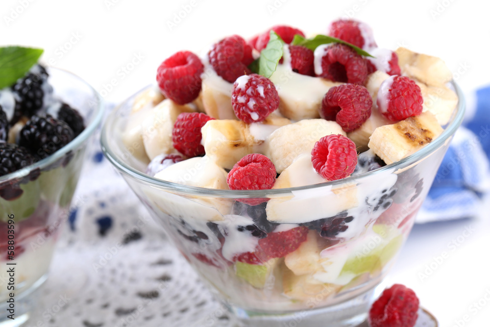 Fruit salad in glass bowls, isolated on white Fruit salad in glass bowls, isolated on white