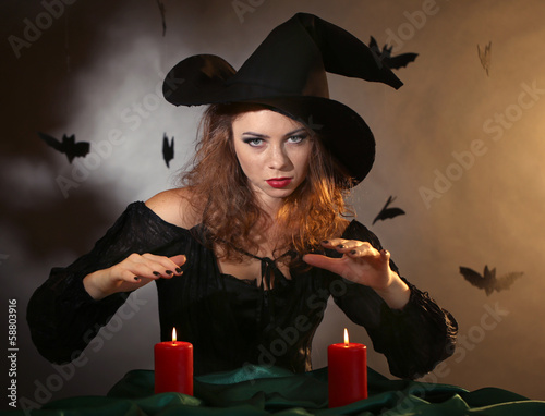 Obraz na plátně Halloween witch on dark background