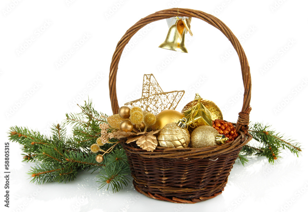 Christmas decorations in basket and spruce branches isolated