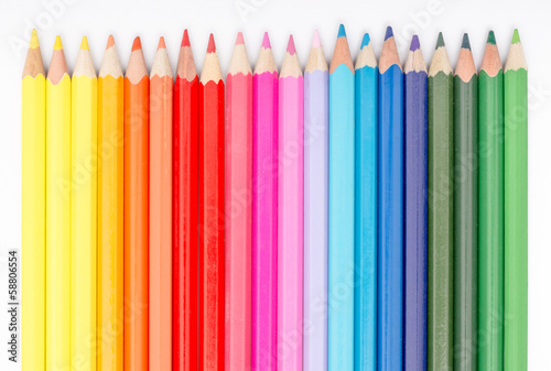 Close Up Of Coloring Crayons Arranged In Rainbow Line