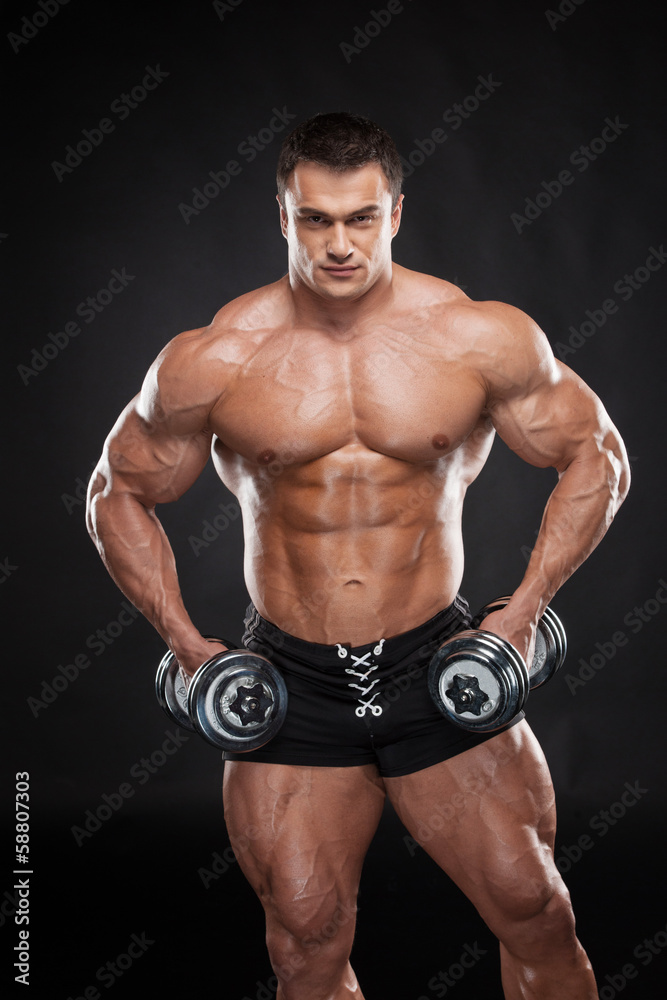 Sexy muscular bodybuilder lifting dumbbell. Sexy muscular bodybuilder lifting dumbbell.