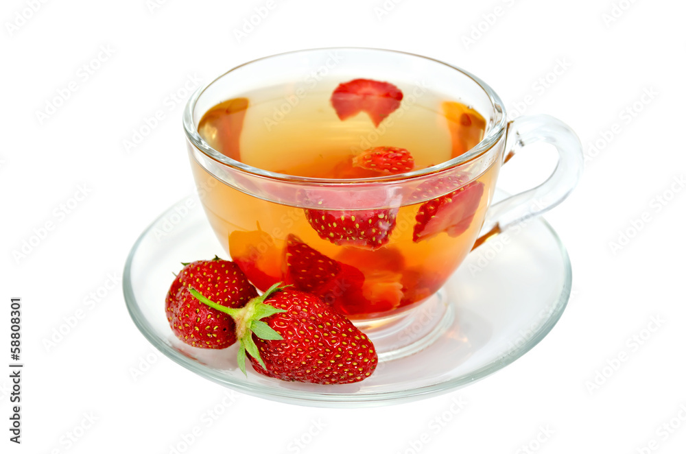 Tea with strawberries in a glass cup Tea with strawberries in a glass cup