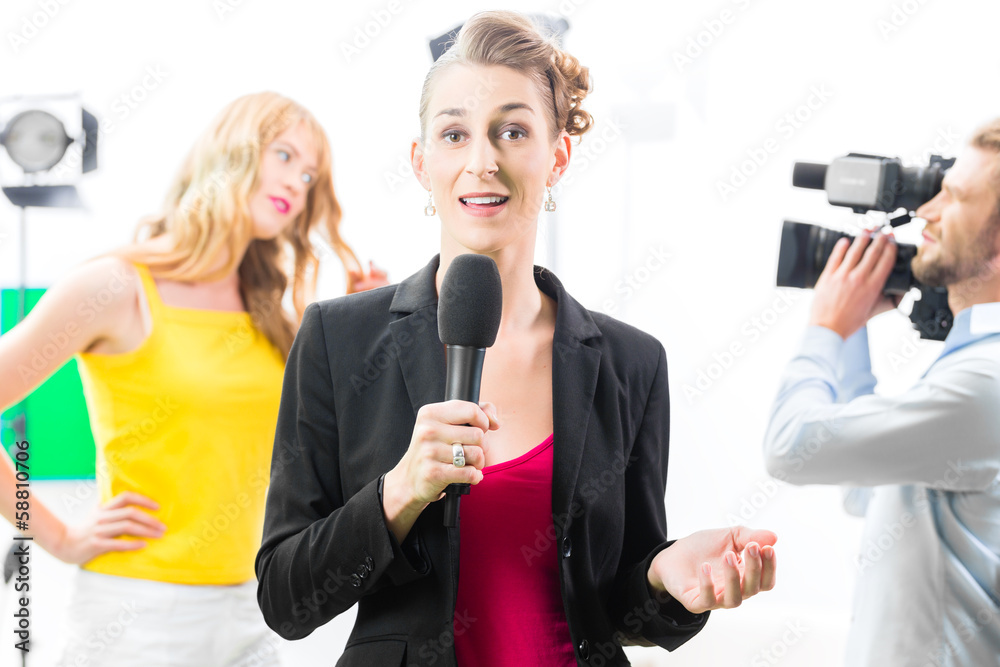 Reporter moderating an interview on film set Reporter moderating an interview on film set