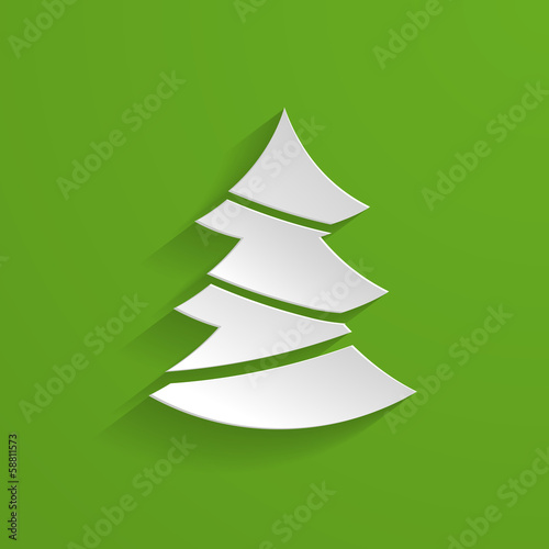 paper Christmas tree on the green background