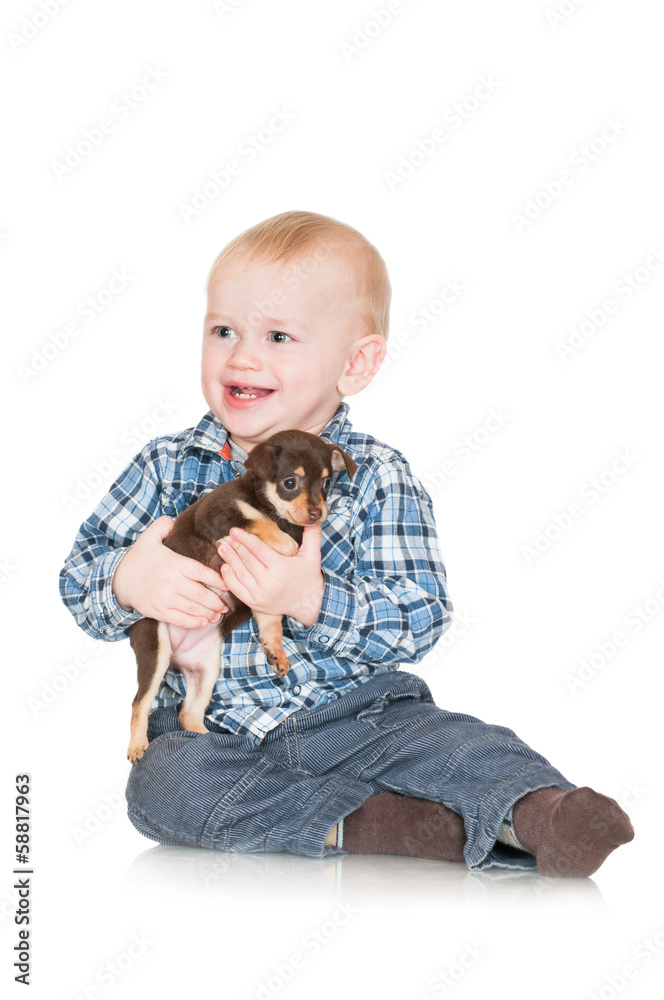 Obraz premium adorable little boy holding a puppy