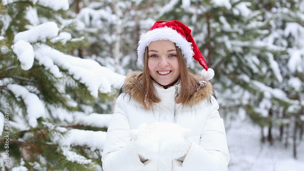 Happy Friendly Woman Blowing Snowflakes Happy Friendly Woman Blowing Snowflakes
