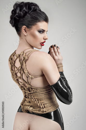 Sexy woman in rope bandage
