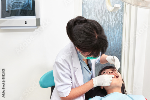 Dentist examing teeth photo