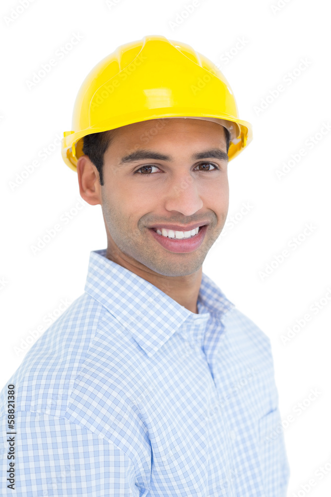 Portrait of a smiling handyman wearing a yellow hard hat Portrait of a smiling handyman wearing a yellow hard hat