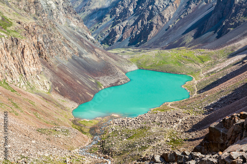Majestic mountain lake in Tien Shan, Kirgizstan photo