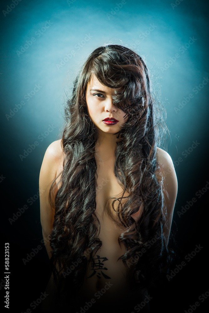 Beautiful brunette Asian woman with long black hair Beautiful brunette Asian woman with long black hair