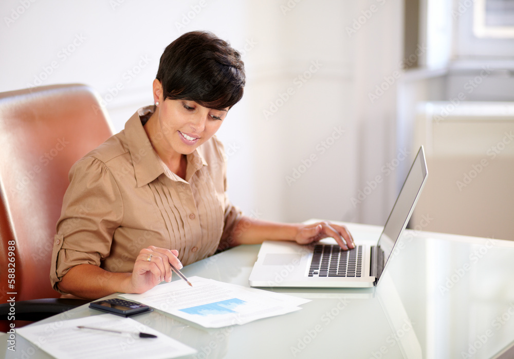 Attractive businesswoman working on her documets Attractive businesswoman working on her documets