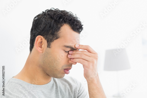 Close-up side view of a thoughtful man in bed © lightwavemedia