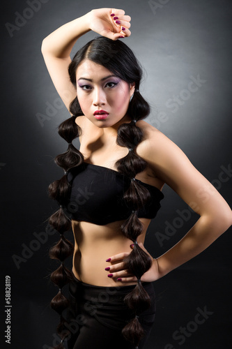 Beautiful brunette Asian woman with long black hair