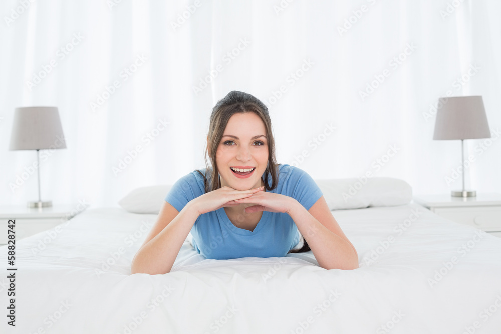 Portrait of a pretty happy woman resting in bed Portrait of a pretty happy woman resting in bed