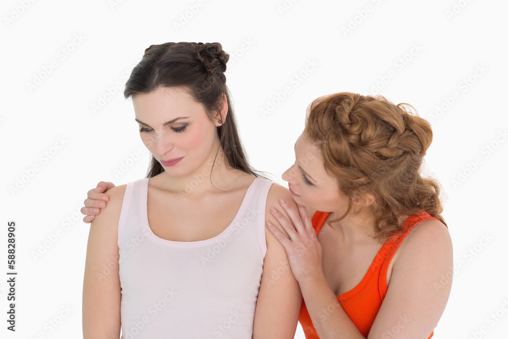 Young woman consoling female friend Young woman consoling female friend