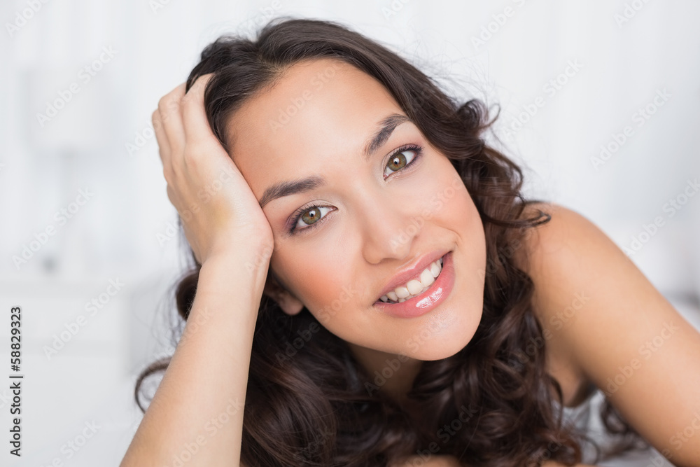 Close-up portrait of a pretty brunette in bed Close-up portrait of a pretty brunette in bed