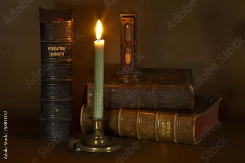 Old books and candle