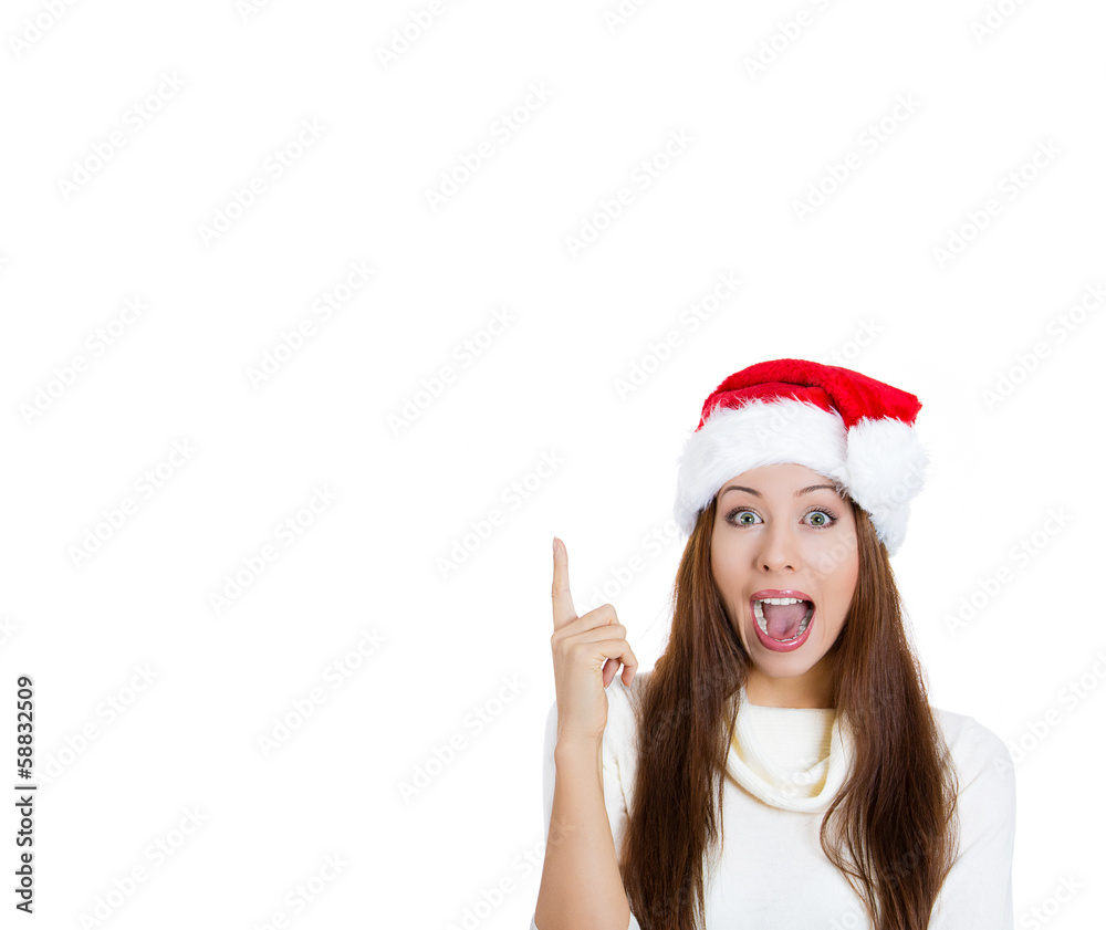 Smiling christmas woman having an idea, pointing up Smiling christmas woman having an idea, pointing up