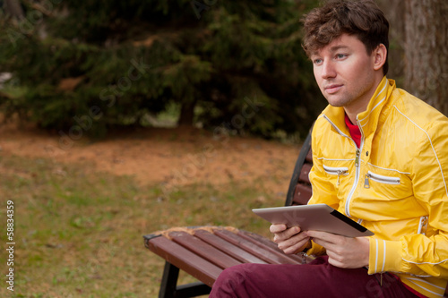 Man with tablet in the Park