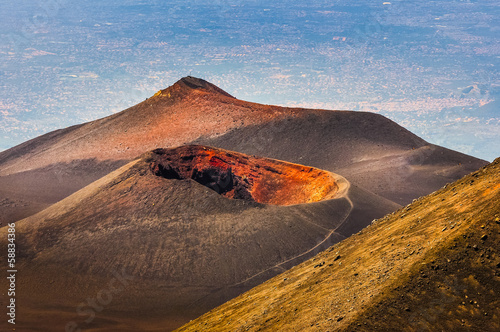 Colorful crater of Etna volcano with Catania in background, Sici