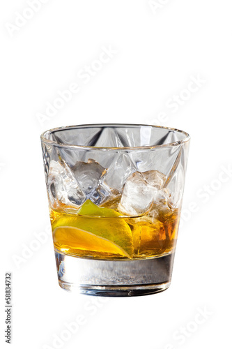 Whisky and lemon cocktail on rocks isolated on white