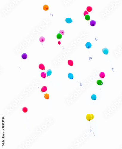 colorful balloons released into the sky on a white background