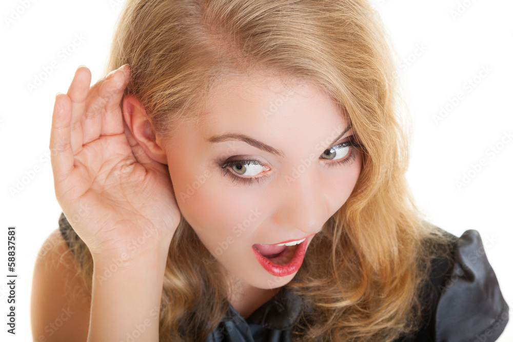 Naklejka premium Blonde surprised gossip girl hand behind ear listening secret