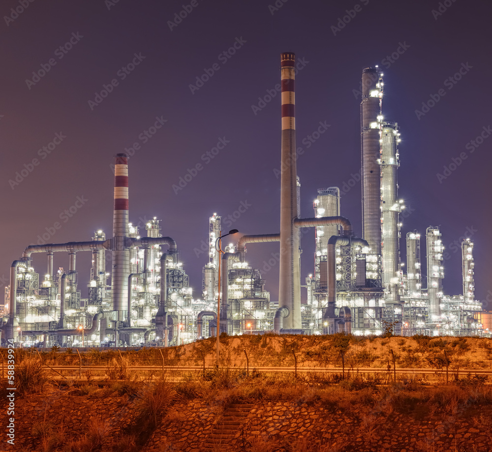 Refinery industrial plant with Industry boiler at night Refinery industrial plant with Industry boiler at night