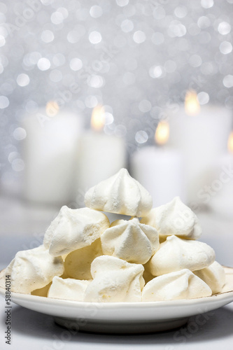 White meringues in christmas setting. Selective focus