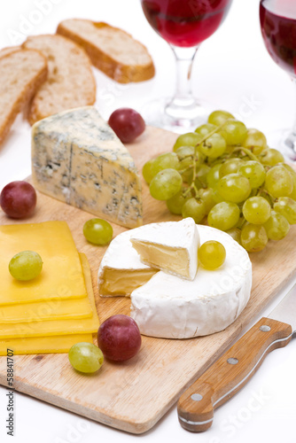 Cheese platter, grapes, ciabatta and two glass of wine