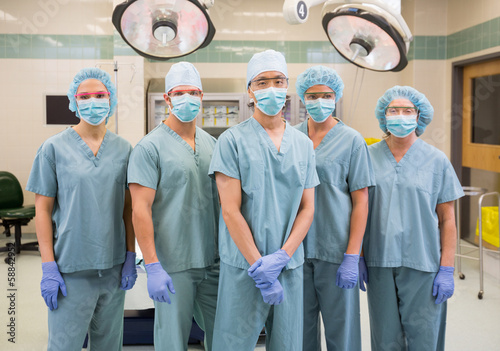 Confident Medical Team Standing In Operation Room
