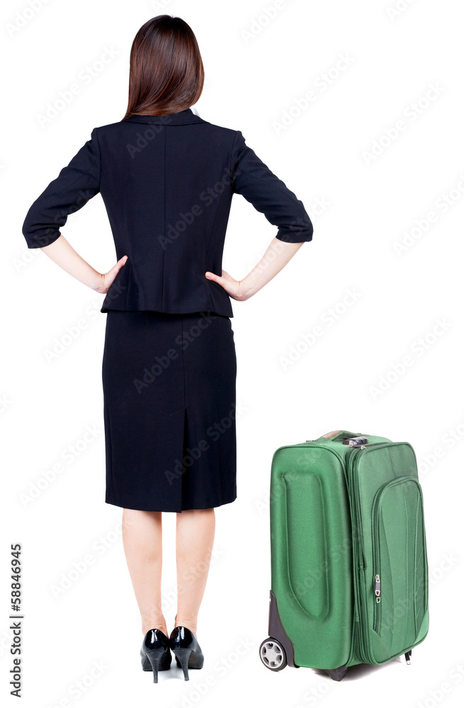 back view of thoughtful business woman traveling with suitcas. back view of thoughtful business woman traveling with suitcas.
