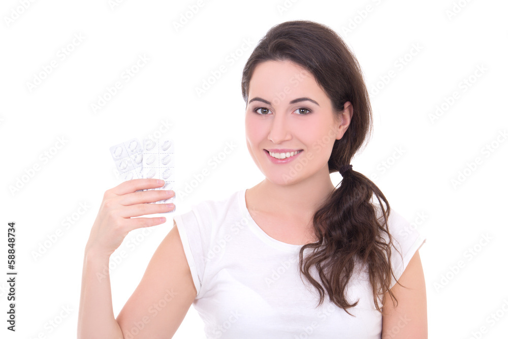 young attractive woman showing package of tablets isolated on wh young attractive woman showing package of tablets isolated on wh