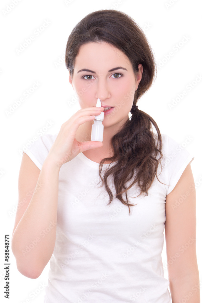 attractive young woman using nasal spray isolated on white attractive young woman using nasal spray isolated on white