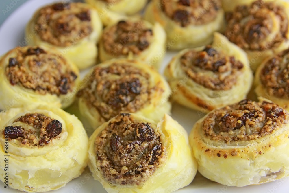 Puff pastry with walnuts and dried grapes.