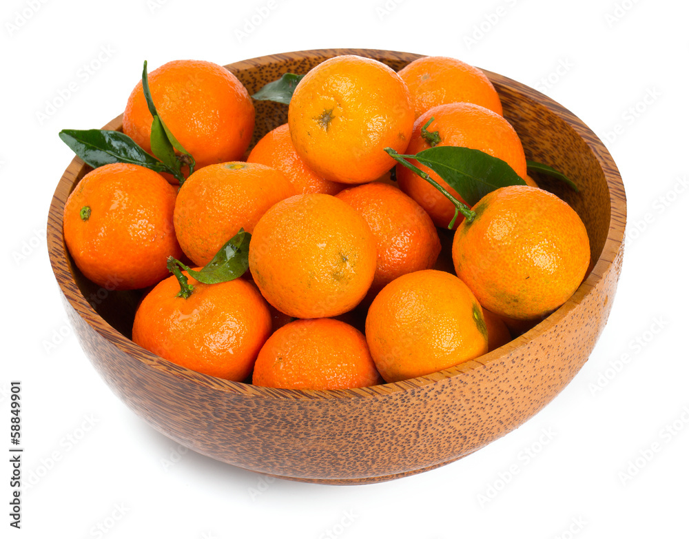 tangerines in a wooden bowl isolated on white tangerines in a wooden bowl isolated on white
