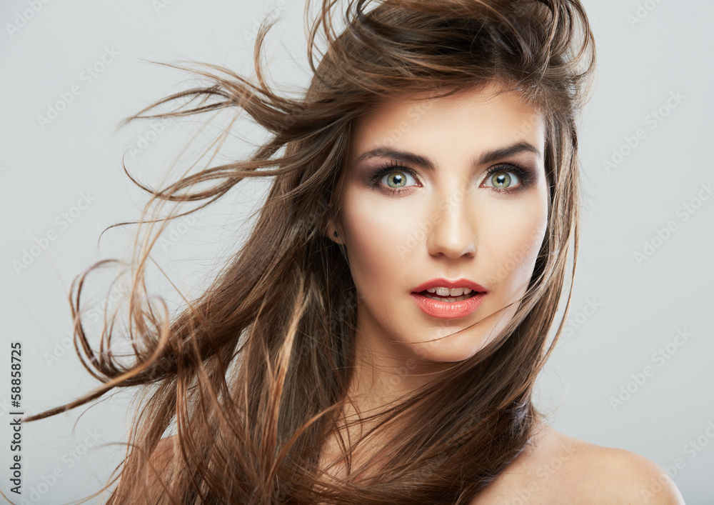 Woman face with hair motion on white background Woman face with hair motion on white background