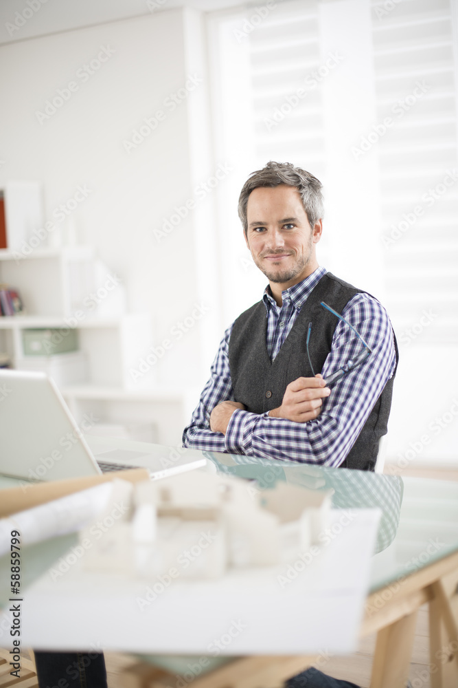Fototapeta premium architect working at his laptop on the office