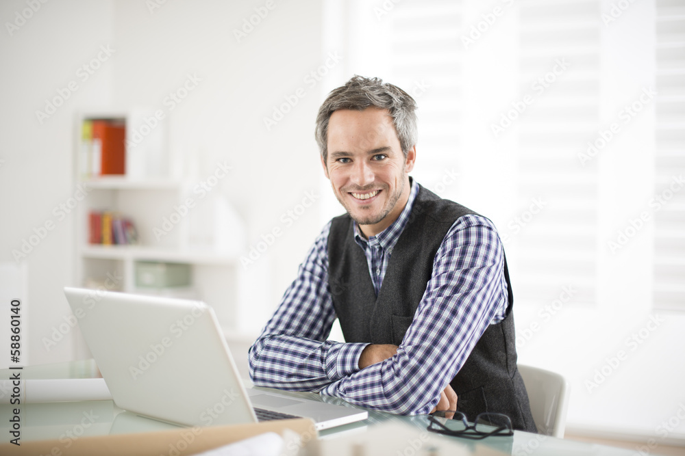 architect working at his laptop on the office architect working at his laptop on the office