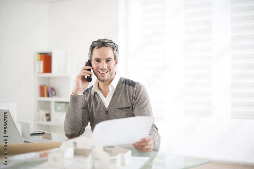 architect working at his laptop on the office