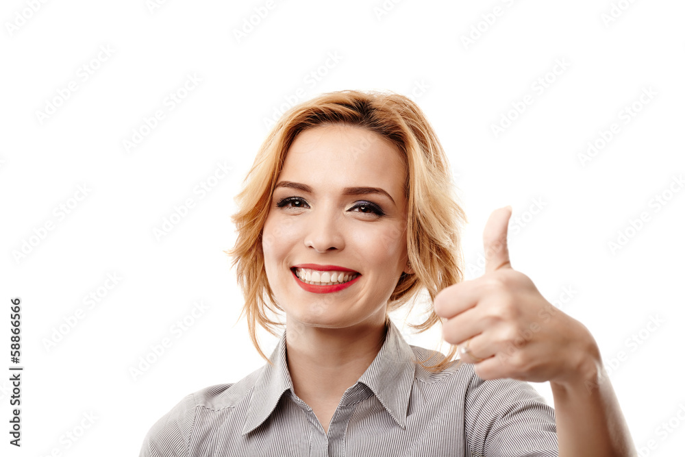 Cheerful businesswoman making the finger up sign Cheerful businesswoman making the finger up sign