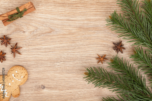 Fototapeta Naklejka Na Ścianę i Meble -  Christmas fir tree, gingerbread cookie and spices